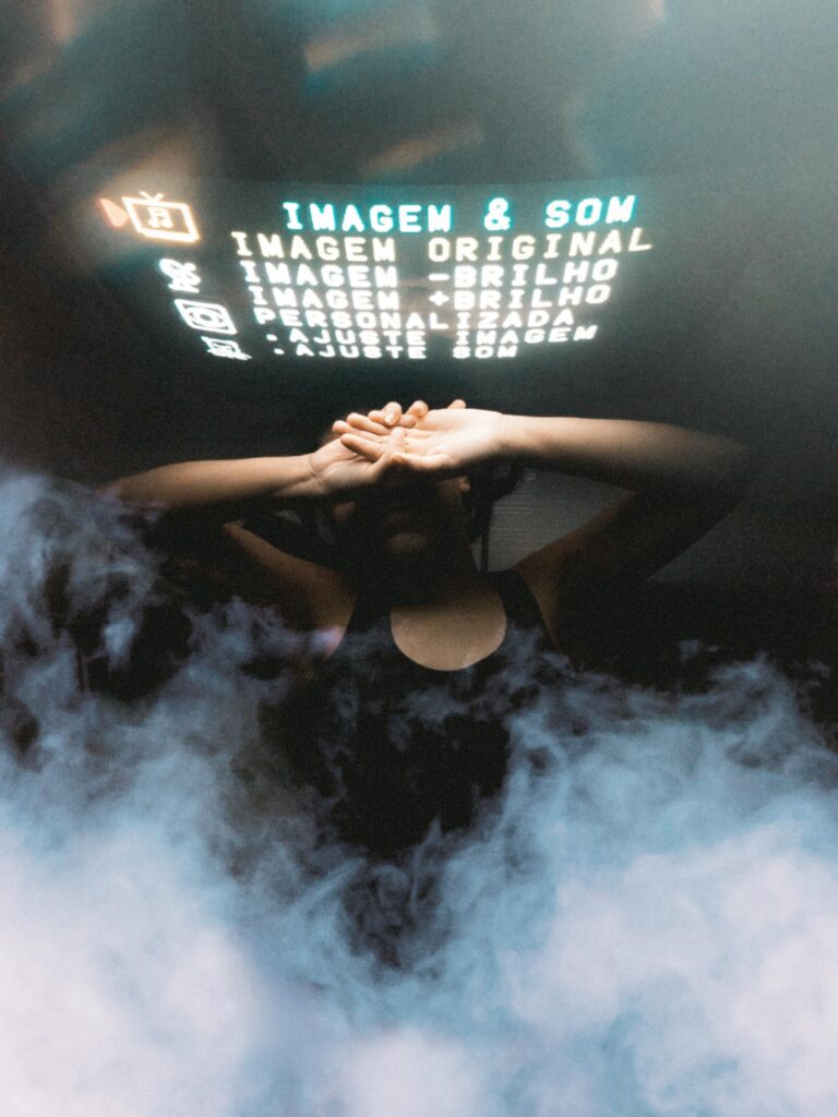 A person behind a mist with digital text projected overhead, creating a mysterious mood.